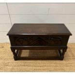 A small oak coffer floral carving to front (H 42cm x 67cm x 31cm)