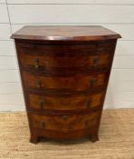 A bow fronted caddy topped chest of four drawers (H 85cm x D 49cm x 61cm)