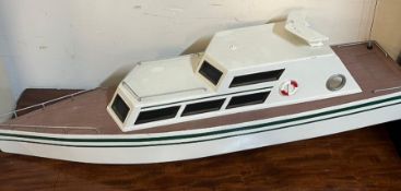 A model motor boat (90cm x 34cm)