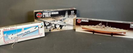 A selection of three vintage Airfix Model kits. A Boeing 727, a Douglas invader and the Bismark