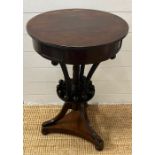 A mahogany side table with twisted centre spindles terminating on a circular platform surround by