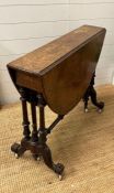 A Victorian Sutherland table on scrolling legs (H72cm W91cm)