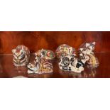 Seven Royal Crown Derby paperweight cats (Largest 12cm x 6cm)