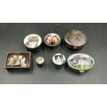 A selection of seven silver cat themed pill boxes.