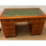 A pedestal desk with green leather writing top (H78cm W122cm D60cm)