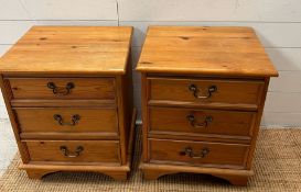 A pair of pine bedsides