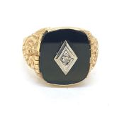 Marked 10K with a full 375 hallmark, a large gentleman’s signet ring. Onyx with a centrally set