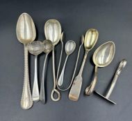 A selection of silver hallmarked cutlery including sugar nips and a baby pusher and spoon. Various