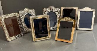 A selection of seven silver picture frames various styles, makers and hallmarks.