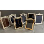 A selection of seven silver picture frames various styles, makers and hallmarks.