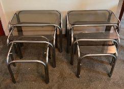 Two sets of vintage nesting side tables, smoked glass and chrome tubular frame (One missing