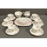 A Shelly part tea service "Bridal Rose" Six side plates, one sandvia plate, one milk jug, one