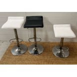 Three chrome modern counter stools