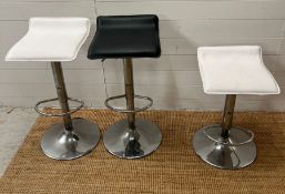 Three chrome modern counter stools