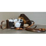 A Leica M2 Rangefinder camera in leather case serial number 976256