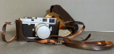 A Leica M2 Rangefinder camera in leather case serial number 976256
