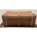 A vintage travel trunk with wooden and metal