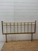 A brass bed head