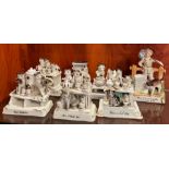 Seven porcelain statues of cats