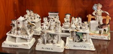 Seven porcelain statues of cats