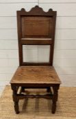 A 17th or 18th Century oak single chair on turned support and cross stretcher