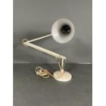 A vintage white anglepoise lamp