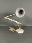 A vintage white anglepoise lamp