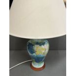 A painted table lamp