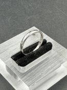 A platinum wedding ring courts design 2.5mm set with twelve small diamonds in flush setting.