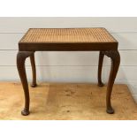A mahogany framed and cane seat stool