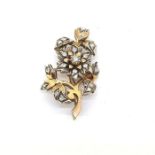 Vintage flower brooch in yellow and white metal set with rose cut diamonds. Approximately 5 x 2.5cm