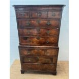 A George III style chest on chest, three small drawers followed by graduated drawers below, two