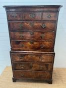 A George III style chest on chest, three small drawers followed by graduated drawers below, two