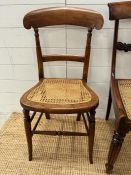 Three mahogany Edwardian cane seated chairs to include a pair.