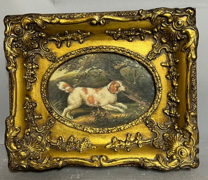 A miniature oil of a dog in woodland in a gilt frame 18cm x 15cm