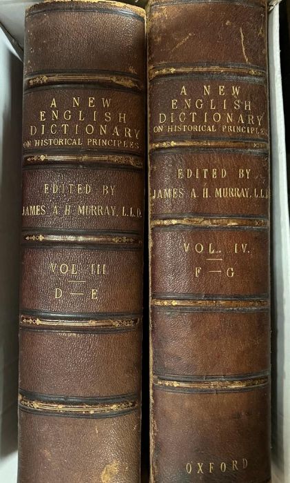 Volumes of leather bound "A New English Dictionary" edited by J.A.H Murray