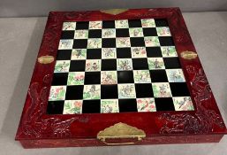 A Contemporary Oriental themed chess set.