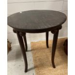 A circular side table on out sprayed legs and ball details to sides (H55cm Dia48cm)