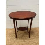 A Sheraton style side table on down swept slender legs and string inlay