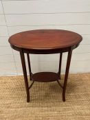 A Sheraton style side table on down swept slender legs and string inlay