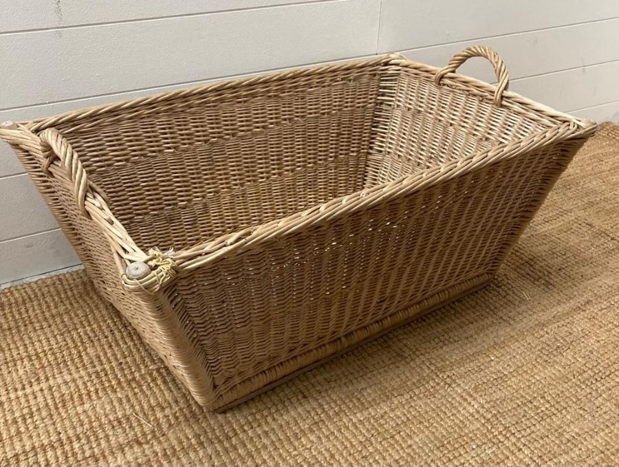 A selection of four two handled wicker baskets