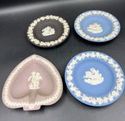 Four Wedgewood Jasperware pin dishes in lilac, black and blue