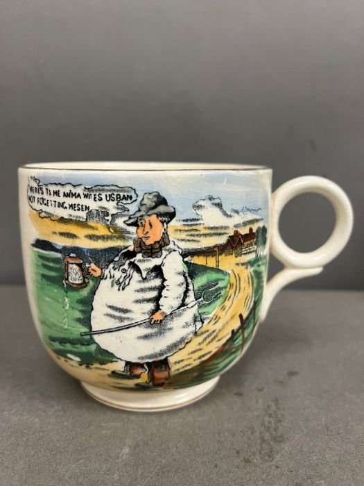 An antique Tykes Motto vintage mug.