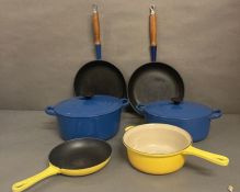 A selection of Le Creusset cookware to include Skillets and casserole dishes, various colours