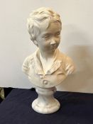 A bust of a boy on a marble base signed Houdon 1875