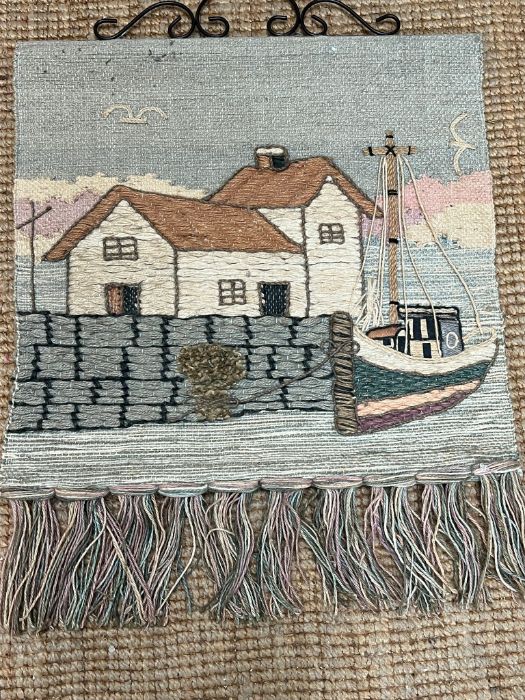 A needle point wall hanging