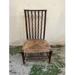 An Arts and Crafts occasional chair with rush seat