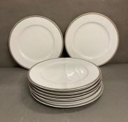 A set of eight LSA dinner plates
