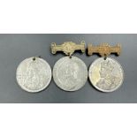 Three work attendance medals from 1909 to 1911.