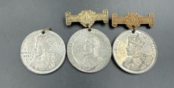 Three work attendance medals from 1909 to 1911.